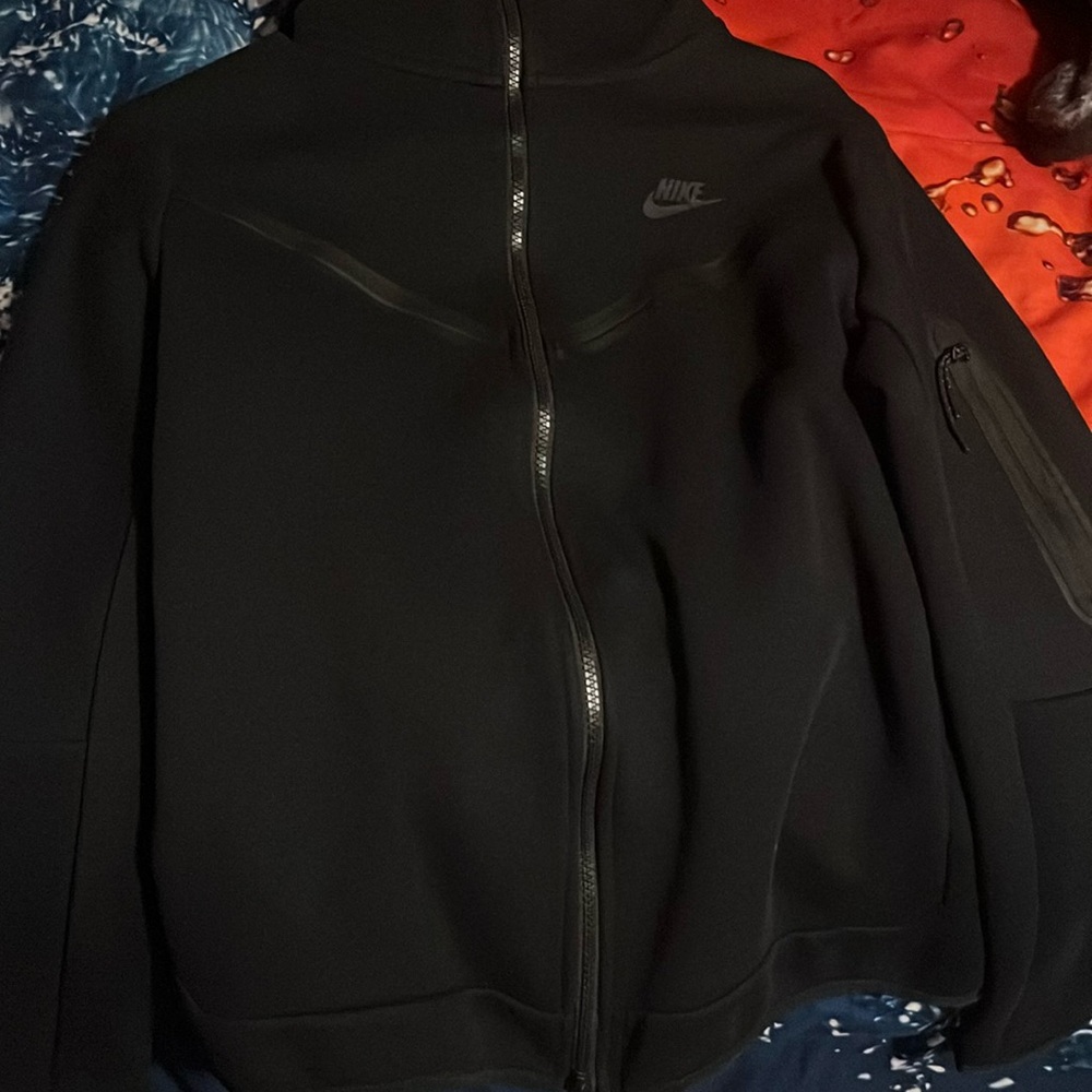 A kids medium Nike tech is brand new. Wore it like three times.